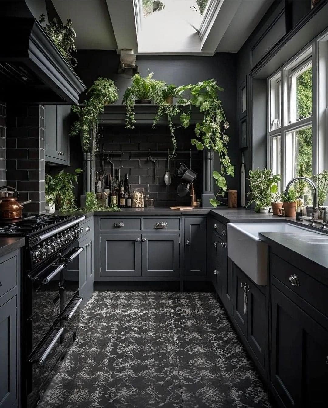 A bespoke Marlowe Kitchens showroom kitchen in charcoal with brass fittings and a natural wood island